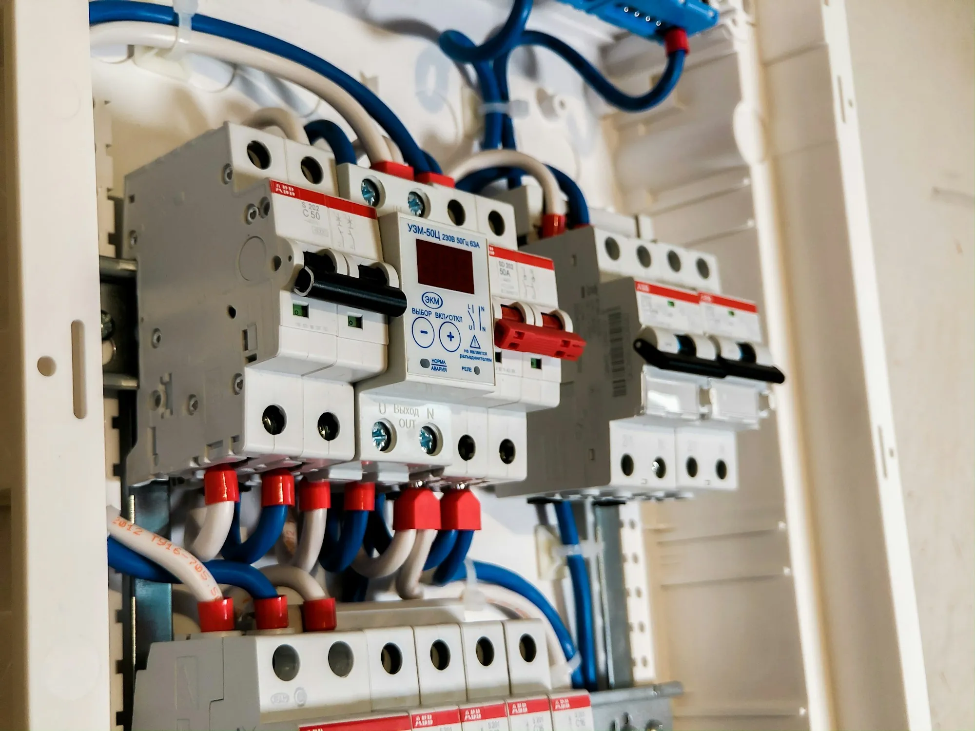 Rows of breakers and wiring in a modern panel